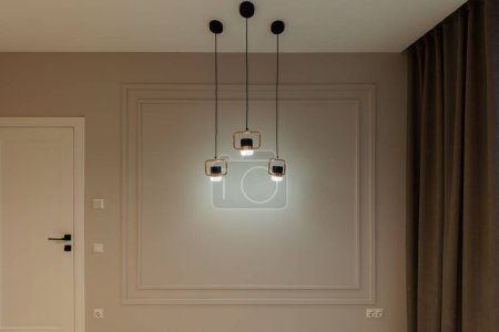 Photo for A modern lamp in a gray room. Interior - Royalty Free Image