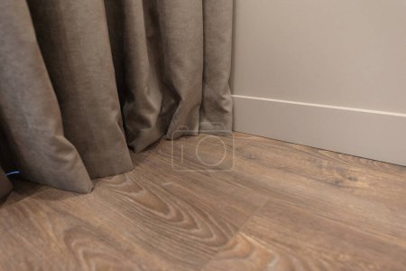 Photo for Line of junction of laminate and plinth. Apartment interior. - Royalty Free Image