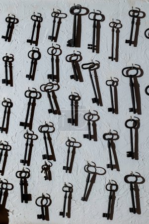 Photo for A wall of vintage metal keys. Keys to the gate, tower, castle. Texture of old keys. - Royalty Free Image