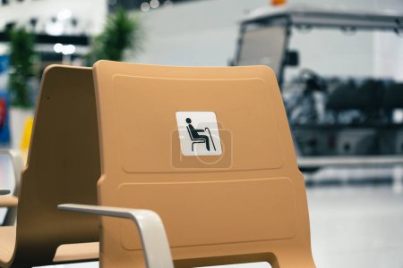 Photo for Disable chair seats in a new airport with nobody. High quality photo - Royalty Free Image