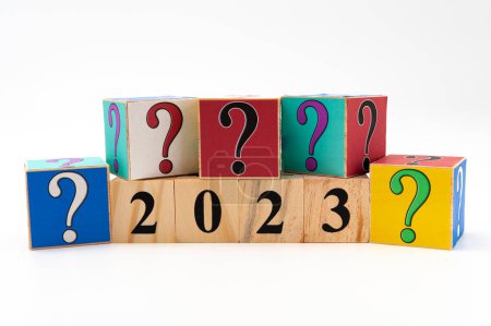 Photo for 2023 with question mark written on wooden blocks in horizontal direction isolated on white background with copy space. - Royalty Free Image