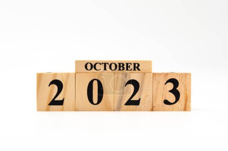 Photo for October 2023 written on wooden blocks isolated on white background with copy space. - Royalty Free Image