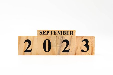 Photo for September 2023 written on wooden blocks isolated on white background with copy space. - Royalty Free Image