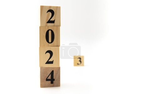 Photo for Number 2024 and number 3 written on wooden blocks in vertical direction isolated on white background. - Royalty Free Image