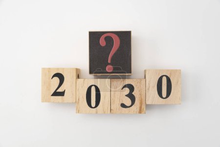 Photo for Number 2030 and question mark written on wooden blocks isolated on white background. - Royalty Free Image