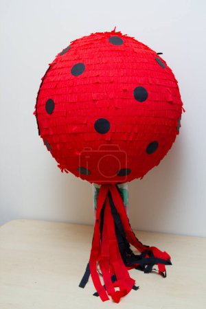 round red pinata ball ladybug