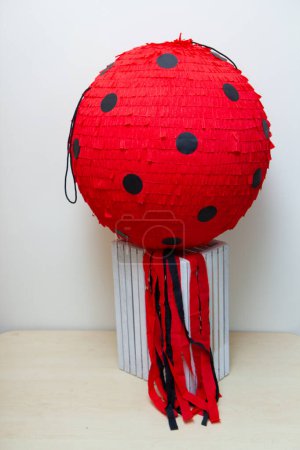 round red pinata ball ladybug