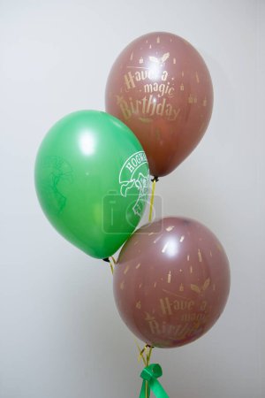 Photo for Green and brown helium balloons for birthday - Royalty Free Image