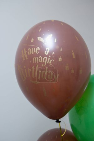 Photo for Green and brown helium balloons for birthday - Royalty Free Image