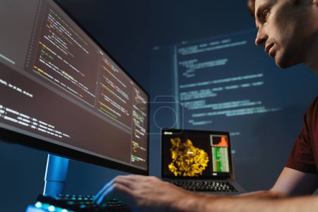 Photo for Closeup of concentrated programmer working on pc programming, writing code for application or website design at home office for software development company - Royalty Free Image
