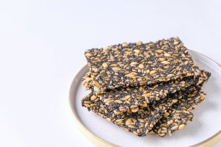 Seed crackers on white background with copy space