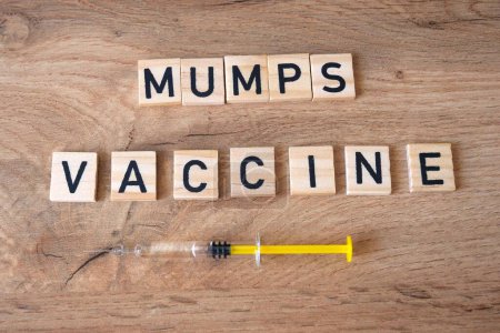 Photo for Mumps vaccine concept. Syringe on the table. - Royalty Free Image
