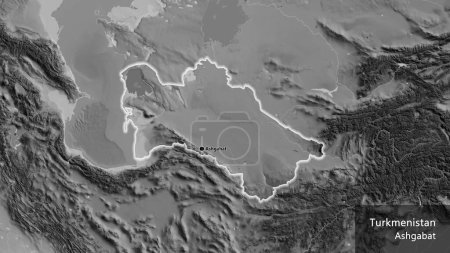 Photo for Close-up of the Turkmenistan border area on a grayscale map. Capital point. Glow around the country shape. English name of the country and its capital - Royalty Free Image