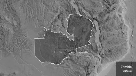 Photo for Close-up of the Zambia border area highlighting with a dark overlay on a grayscale map. Capital point. Outline around the country shape. English name of the country and its capital - Royalty Free Image