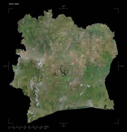 Shape of a high resolution satellite map of the Ivory Coast, with distance scale and map border coordinates, isolated on black