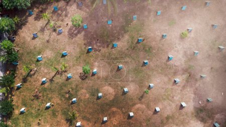 Aerial view of a rooster farm with small houses for the roosters. Home chicken farm in Asia.