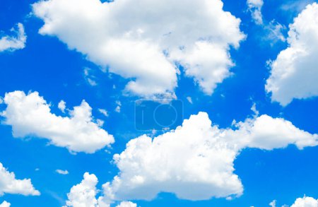 Photo for Dreams of Daylight: Blue Skies and Floating Clouds - Royalty Free Image
