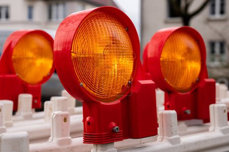 Photo for Orange-red signal lights of the road barrier. Close-up. - Royalty Free Image