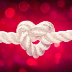 White Rope With Heart Shape Knot On Red Bokeh Background - Tie The Knot - Marriage And Valentine Concept