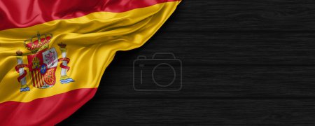 Téléchargez les photos : Gros plan du drapeau d'Espagne sur le fond en bois noir rendu 3d - en image libre de droit
