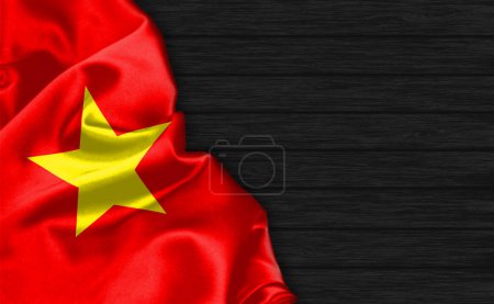 Foto de Primer plano de la bandera de Vietnam en la parte superior del fondo de madera negro - Imagen libre de derechos