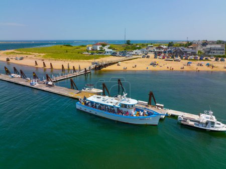 Photo for Captain's Fishing Parties cruise ship Captain George aerial view at Plum Island Beach dock on Merrimack River, Newburyport, Massachusetts MA, USA. - Royalty Free Image
