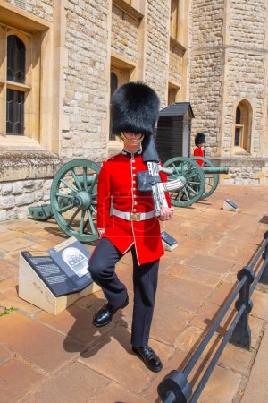 Photo for King's Life Guard in infantry uniform in front of Waterloo Block in Tower of London, London, England, UK. Tower of London is a UNESCO World Heritage Site since 1988. - Royalty Free Image