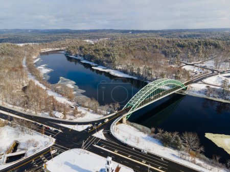 Photo for Merrimack River and Tyngsborough Bridge aerial view in winter in town center of Tyngsborough, Massachusetts MA, USA. - Royalty Free Image