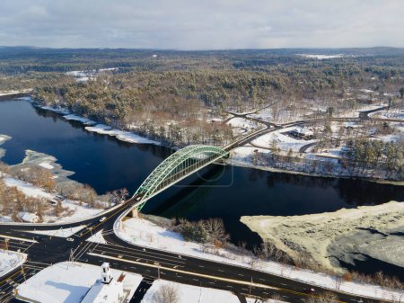 Photo for Merrimack River and Tyngsborough Bridge aerial view in winter in town center of Tyngsborough, Massachusetts MA, USA. - Royalty Free Image