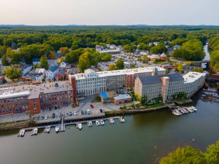 Photo for Newmarket Mills building aerial view on Lamprey River on Main Street in historic town center of Newmarket, New Hampshire NH, USA. Now this building is Rivermoor Landing Apartment. - Royalty Free Image