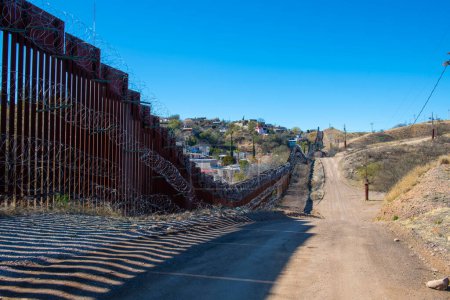 Photo for United States Mexico Border Wall between Nogales Arizona and Nogales Sonora on International Street in city of Nogales, Arizona AZ, USA. - Royalty Free Image