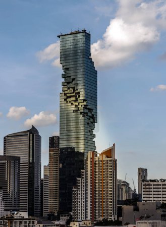 Photo for Bangkok, Thailand - 11 Nov 2022 : Architectural exterior view of King Power Mahanakhon Building is a mixed-use skyscraper with other modern high-rise buildings in central business district of Bangkok city. Geometric of modern high-rise buildings desi - Royalty Free Image