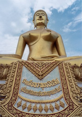 Photo for Nakhon Sawan, Thailand Apr 24, 2023 - The Sacred Buddha is named "Phra Buddhachinnasi" in Wat Khiriwong Temple, which has the blue sky background. The temple is located on the top of the Hill and It is worshiped by people of Pak Nam Pho. Translation - Royalty Free Image