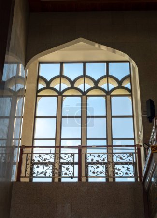 Photo for Bkk,Thai-June 23,2023-The sunshine lights through the glass window frame and there have wrought iron decorative rails patterns in the corridor. Architecture of Interior built for the Islamic Affairs, which is designed with elegant for Al Alawi Mosque - Royalty Free Image