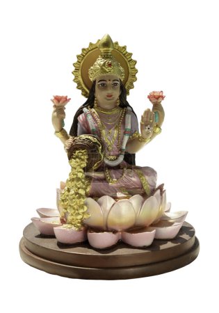 Foto de Hindu cosmos Maha laxshmi statue decorated with Flower Garland isolated on white background with clipping path. Statue of Goddess of Wealth, Selective focus. - Imagen libre de derechos