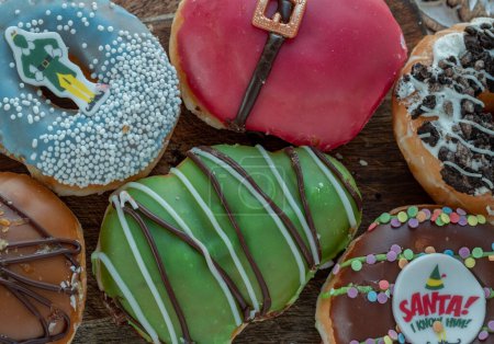 Photo for Many Original Glazed Doughnuts placed on wooden cutting board. The concept of delicious delicious amazing glazed donuts, Space for text, Selective Focus. - Royalty Free Image