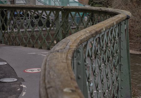 London, UK - Dec 25, 2023 - Traditional metal Hammersmith bridge for pedestrians and cyclist over the River thames. Cast-iron bridge, Space for text, Selective focus.