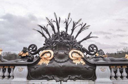 France, Paris - Jan 04, 2024 - Backside of Nymphes de la Seine sculpture of the downstream parapet of the Alexander III Bridge (Pont Alexandre III) with sky background in Paris. Space for text, Selective focus.
