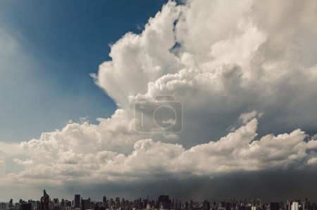 Bangkok, Thailand - May 20, 2024 - Amazing sky with fluffy white clouds over metropolitan city. They can be used as Wallpaper, Copy space, Selective Focus.