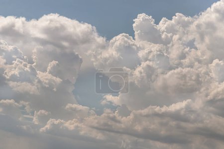 The sky is being covered with fluffy white clouds. Concept idea of Imaginative clouds nature, Amazing sky like a heaven for background wallpaper and texture, Space for text, Selective Focus.