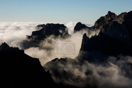 Photo for Mountain peaks among the clouds - Royalty Free Image