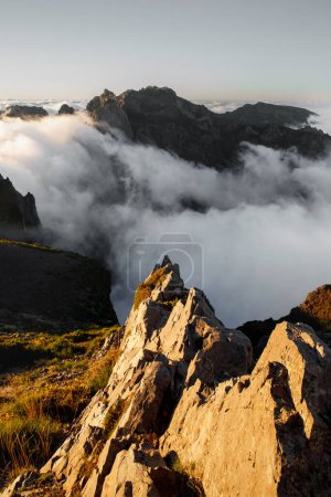 Photo for The stone rocks, Peaks of mountains. Clouds and sunset light background - Royalty Free Image