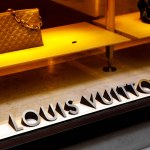 Florence, Italy - March 27, 2023: Louis Vuitton logo on the store showcase
