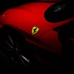 Maranello, Italy - April 01, 2023: Ferrari logo on the red luxury car