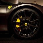 Maranello, Italy - April 01, 2023: Close-up of Ferrari luxury car with metal disk and colorful brakes