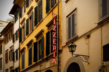 Photo for Signboard of a traditional Italian pizzeria on a narrow street in the old town - Royalty Free Image