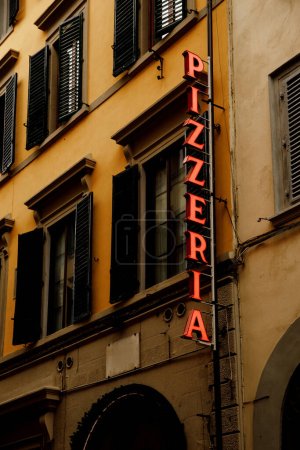 Photo for Signboard of a traditional Italian pizzeria on a narrow street in the old town - Royalty Free Image