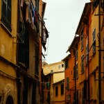 Yellow and red bright houses on narrow traditional streets of an Italian town