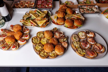 Photo for A delicious and diverse selection of appetizers and finger foods at a party, a catering event, or a buffet - Royalty Free Image