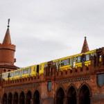 Yellow Berlin metro train on the historic Oberbaum Bridge